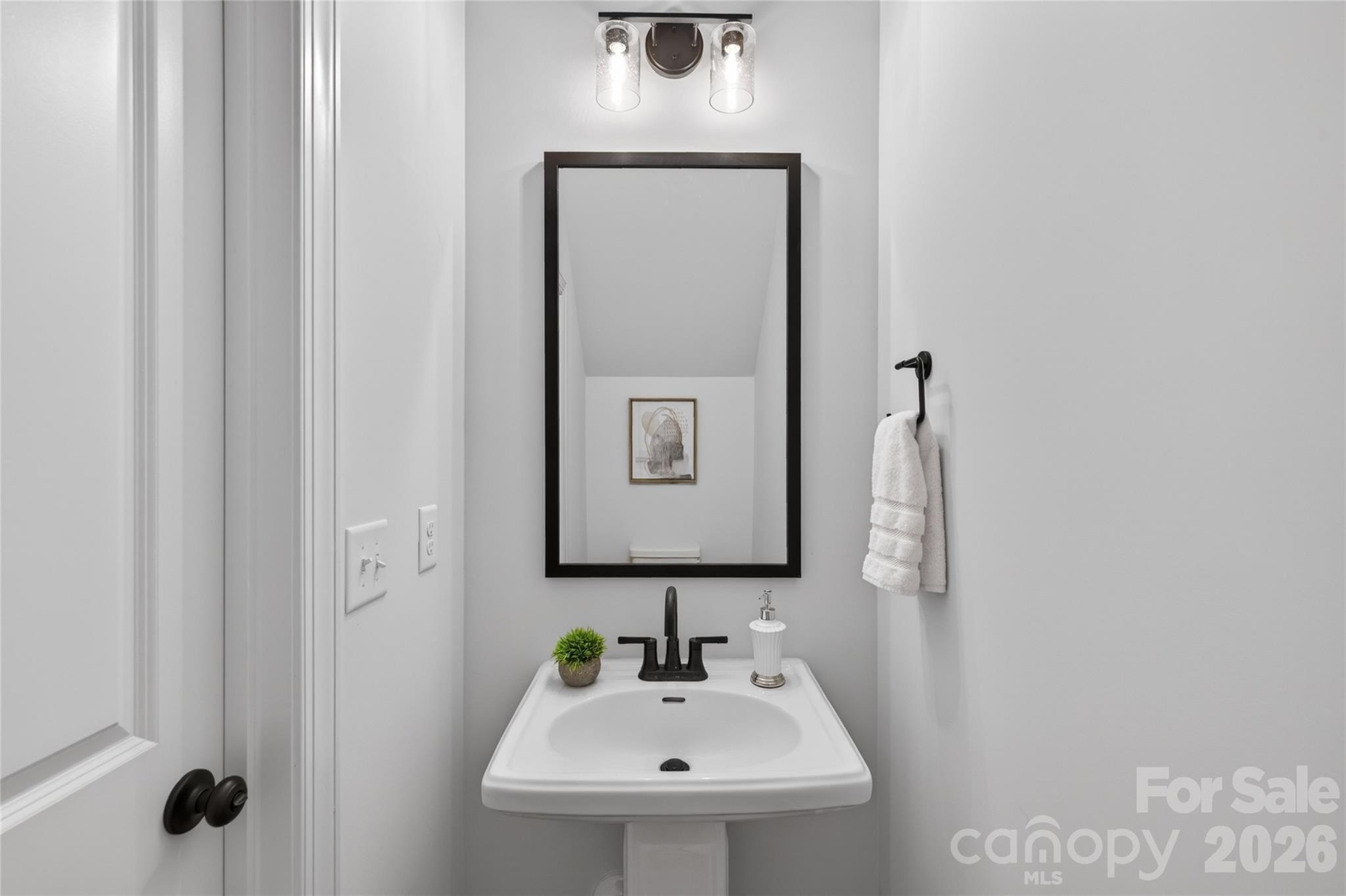2965 Polk And White Road Charlotte, NC 28269 - Photo 14 of 38 a bathroom with a sink and a mirror