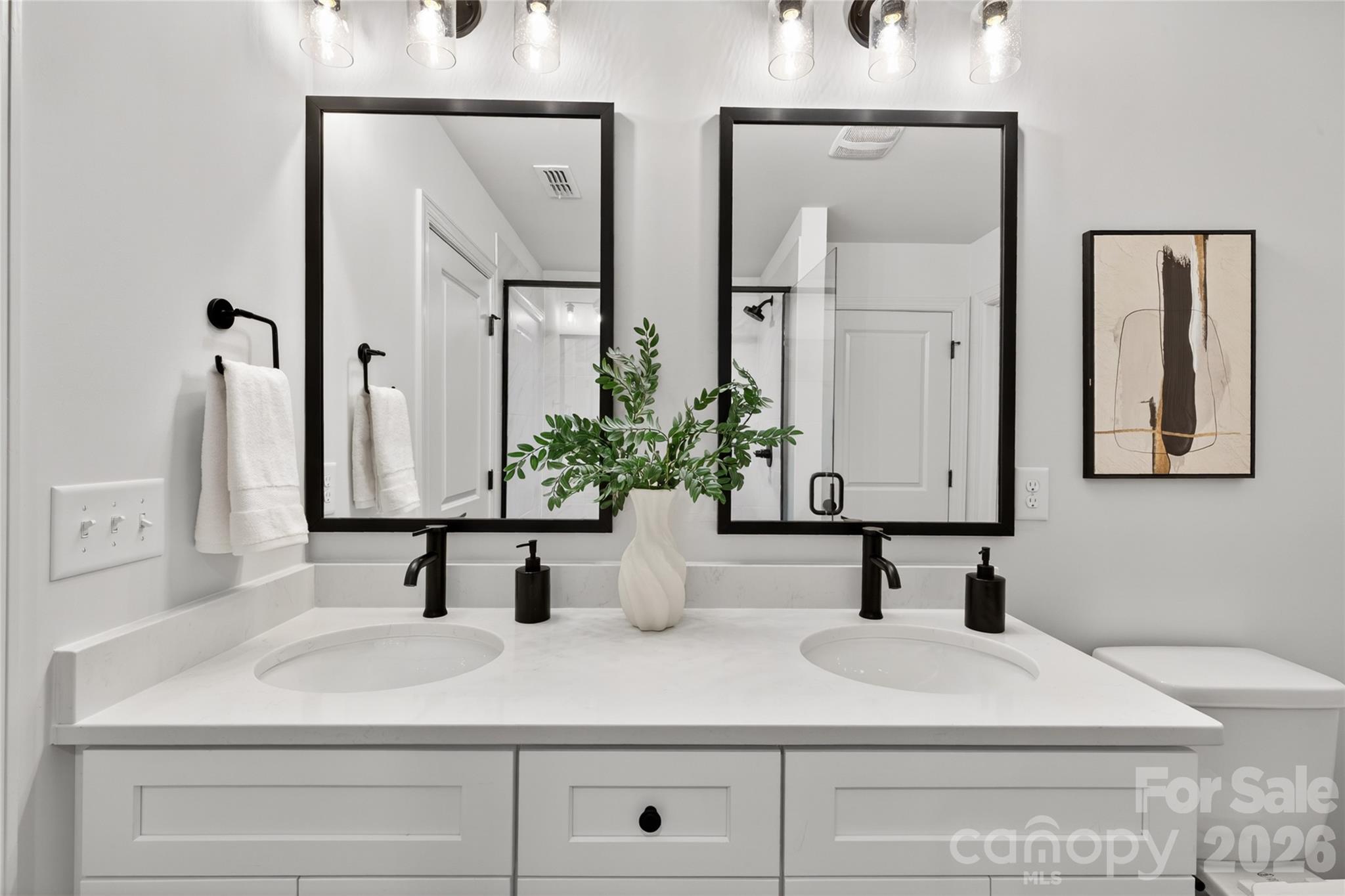 2965 Polk And White Road Charlotte, NC 28269 - Photo 19 of 38 a bathroom with double vanity sinks and a mirror