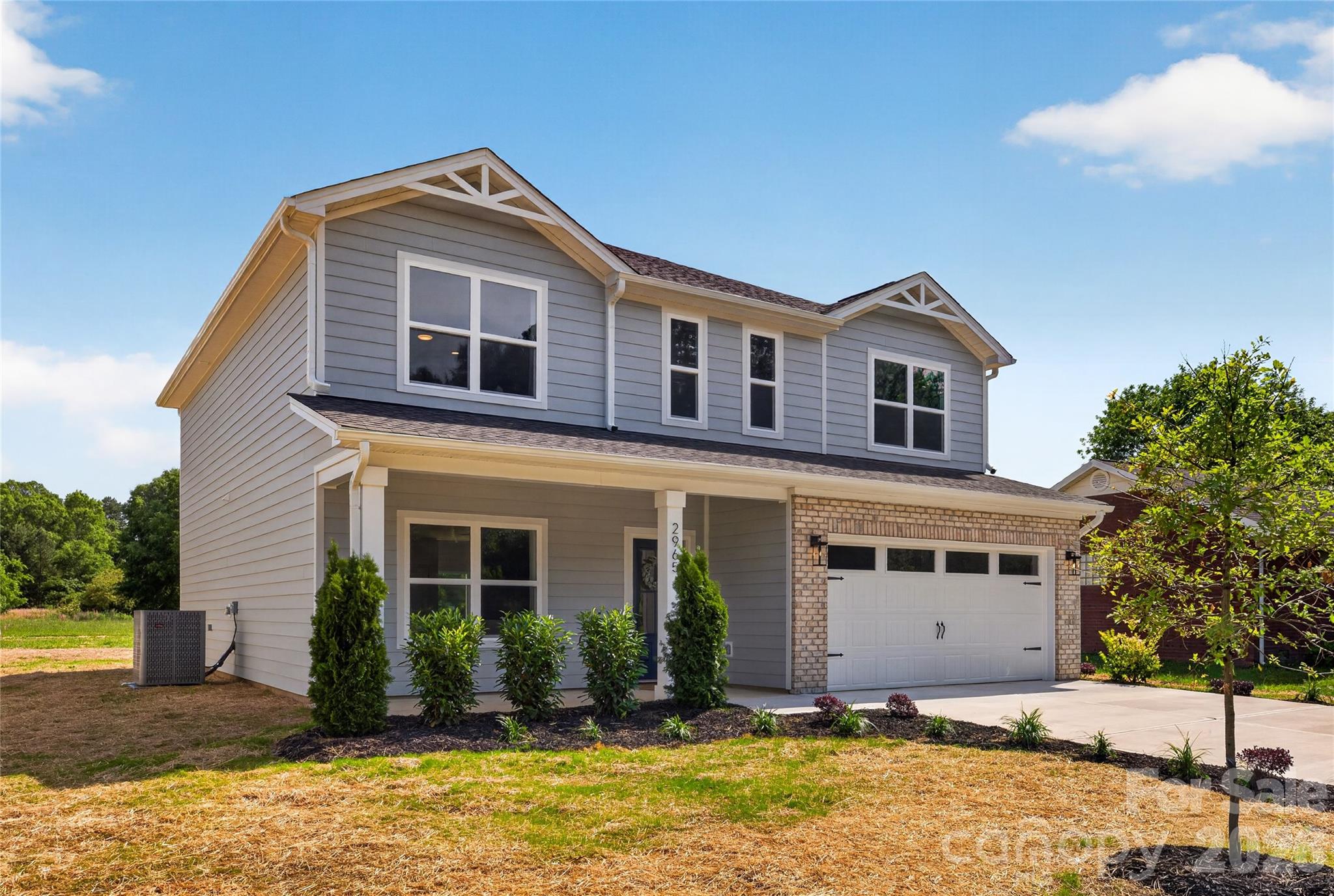 2965 Polk And White Road Charlotte, NC 28269 - Photo 2 of 38 a front view of a house with a yard