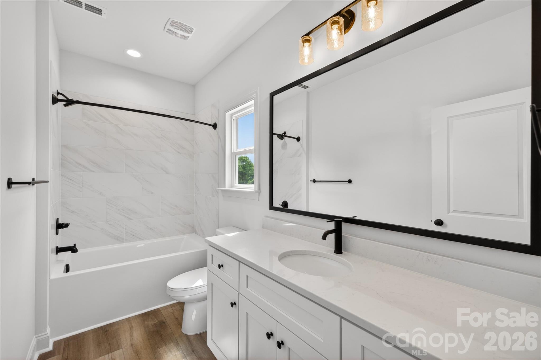 2965 Polk And White Road Charlotte, NC 28269 - Photo 25 of 38 a bathroom with a sink a toilet and shower
