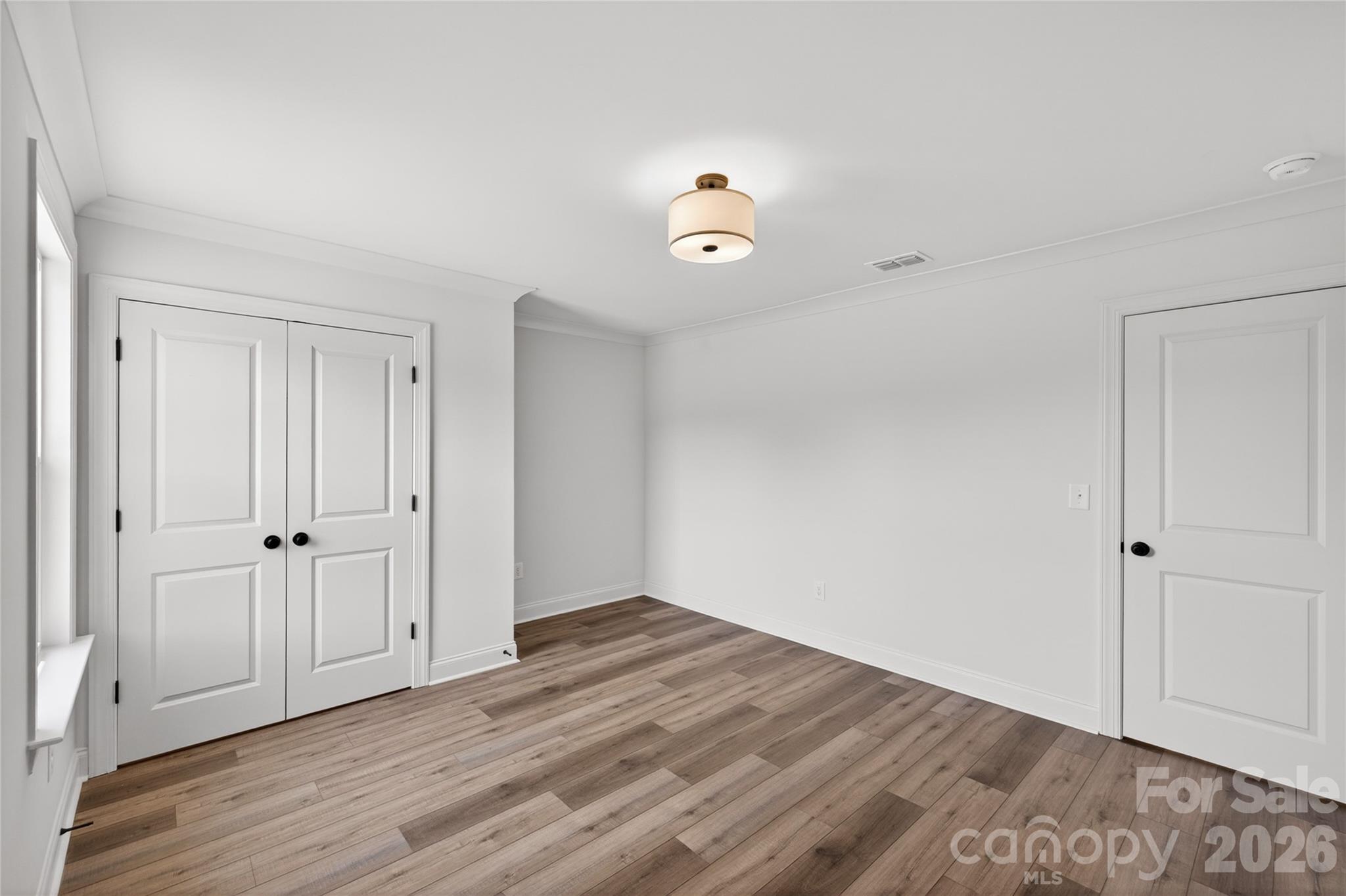 2965 Polk And White Road Charlotte, NC 28269 - Photo 29 of 38 a view of an empty room with wooden floor