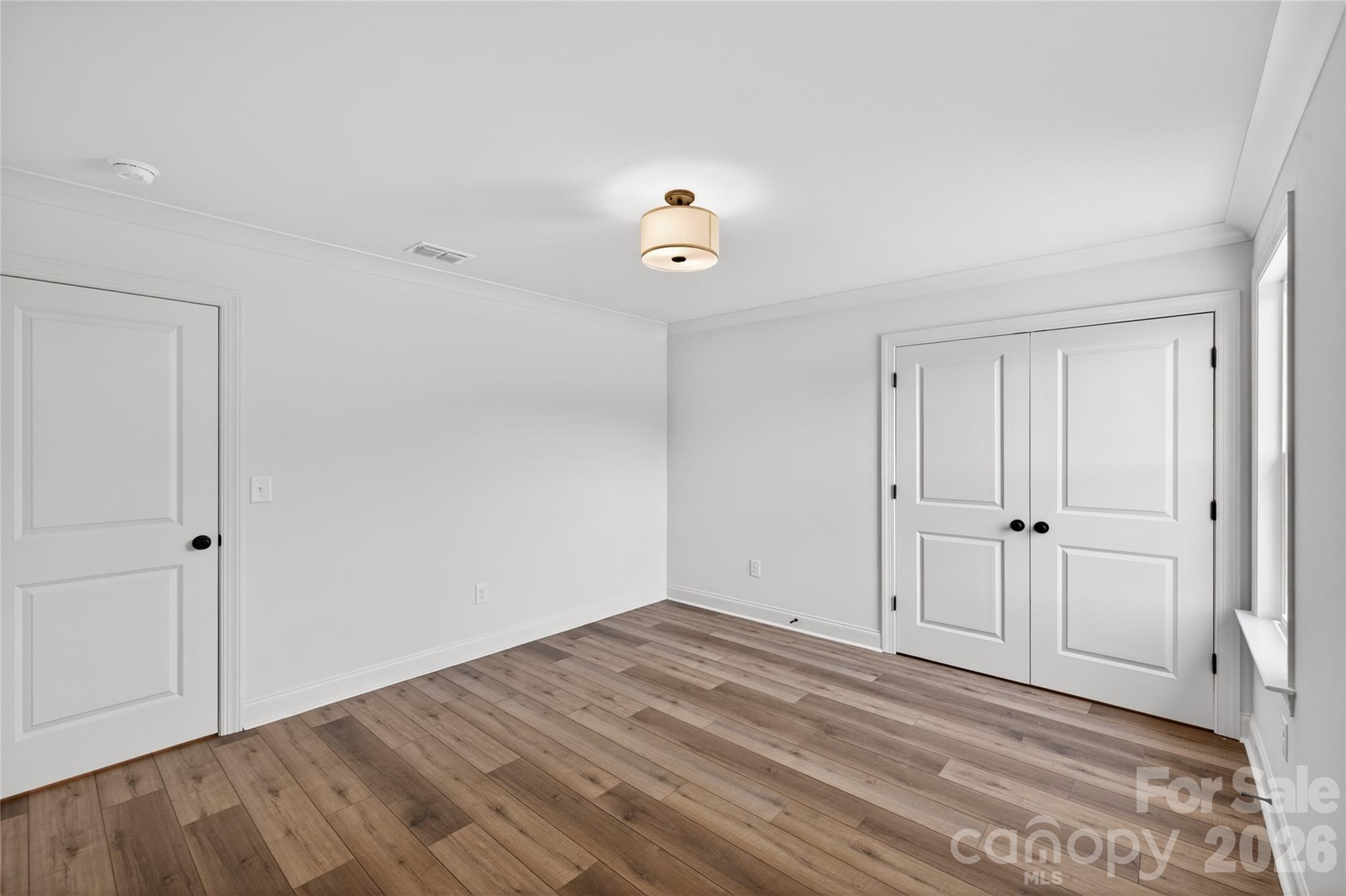 2965 Polk And White Road Charlotte, NC 28269 - Photo 31 of 38 a view of empty room with wooden floor