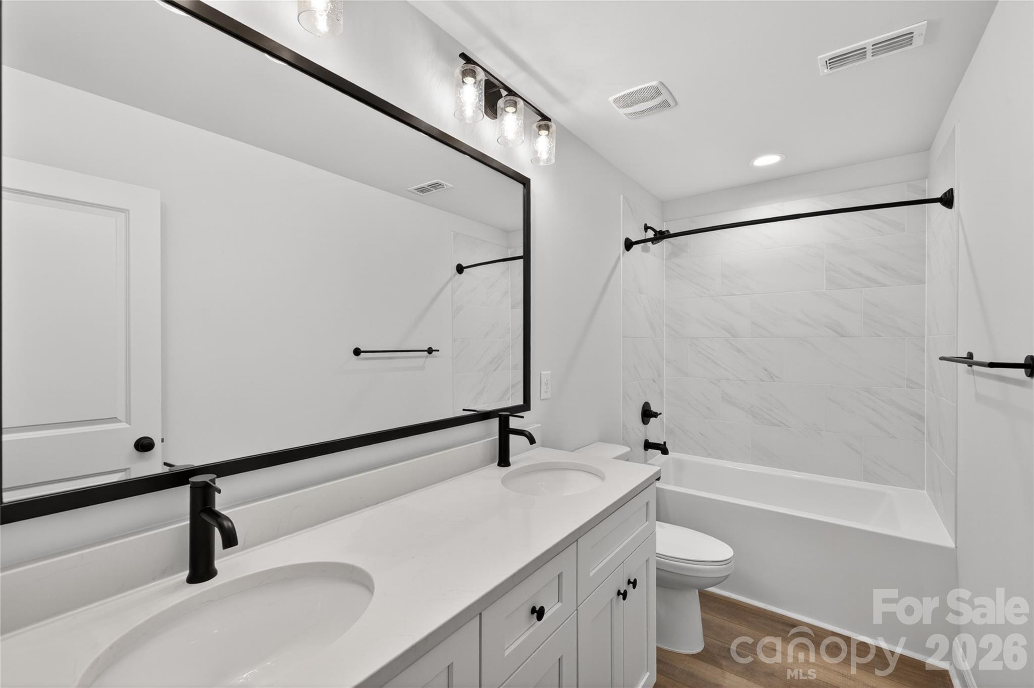 2965 Polk And White Road Charlotte, NC 28269 - Photo 34 of 38 a bathroom with a shower sink vanity and toilet