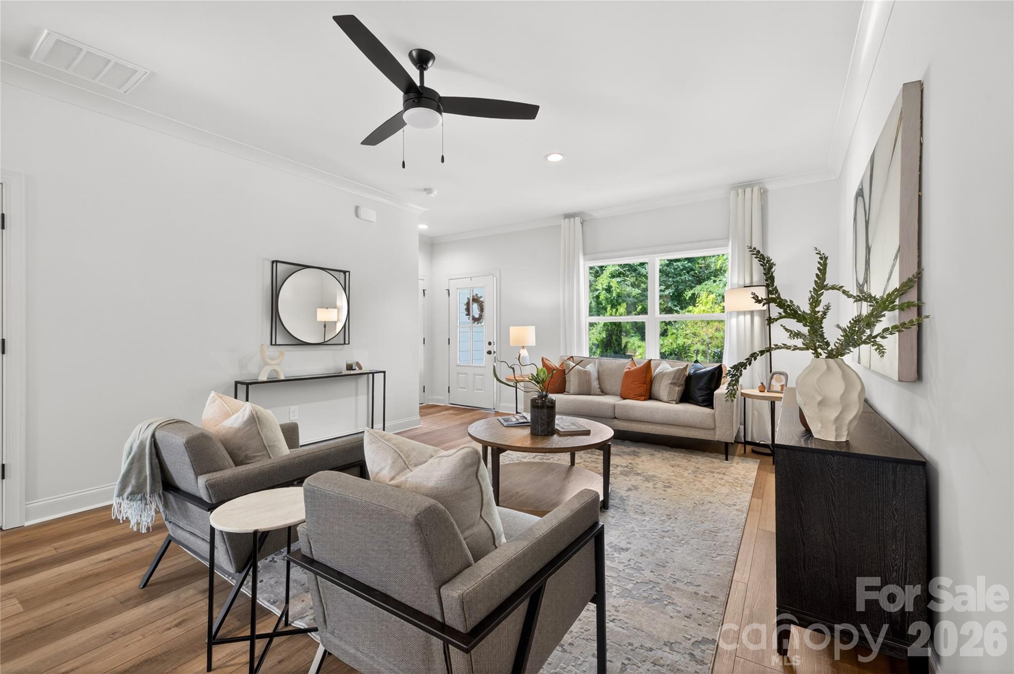 2965 Polk And White Road Charlotte, NC 28269 - Photo 6 of 38 a living room with furniture and a large window