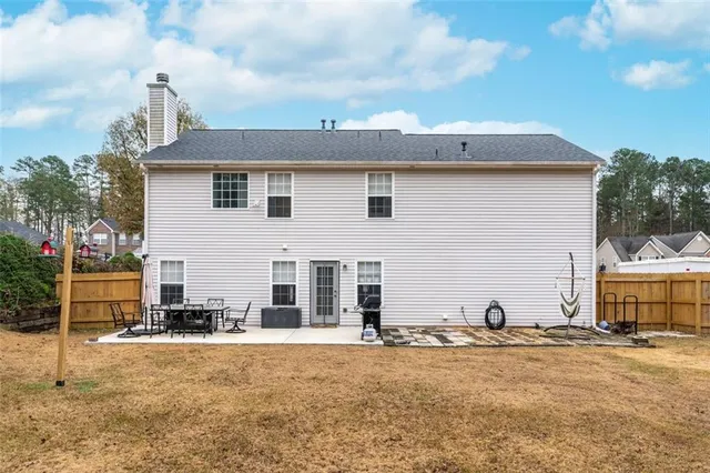 a view of a house with a snow in the yard