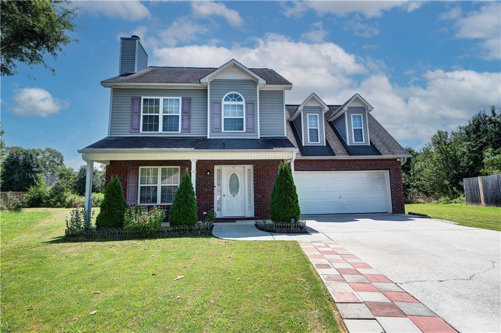 126 Summerfield Lane Northeast Calhoun, GA 30701 - Photo 1 of 1 a front view of a house with garden
