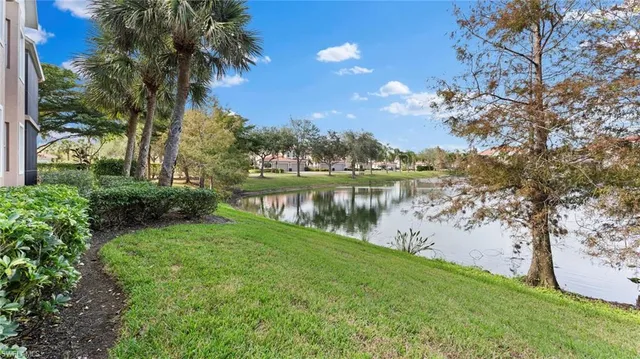 a view of a lake with houses in background
