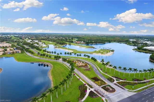 an aerial view of a golf course with swimming pool and outdoor seating