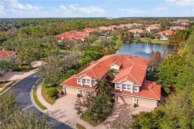an aerial view of a house with a ocean view