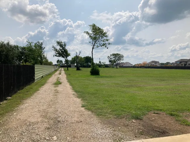 a view of a lake with a big yard