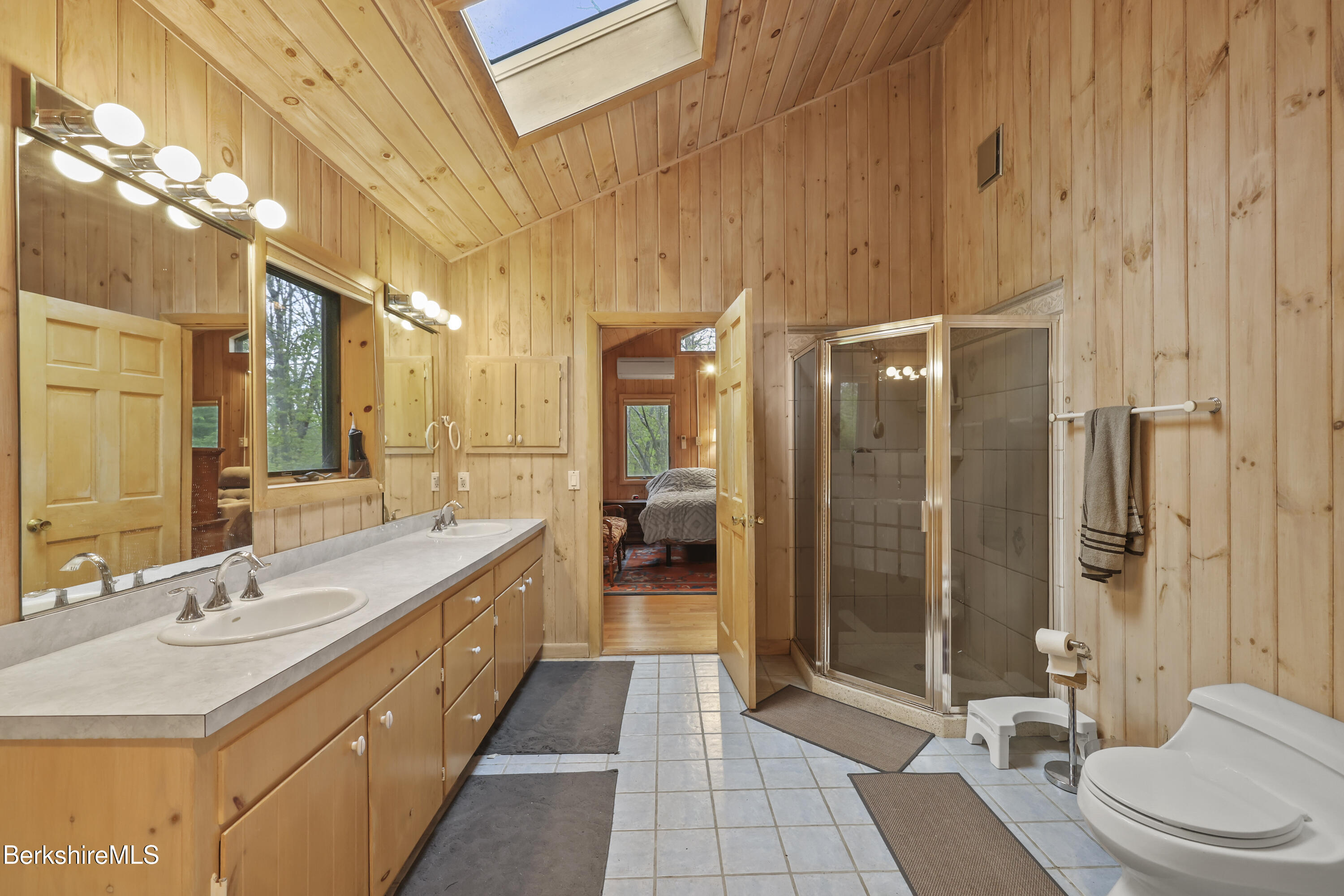 422 Bonny Rigg Hill Road Becket, MA 01223 - Photo 21 of 60 a bathroom with a double vanity sink toilet and shower