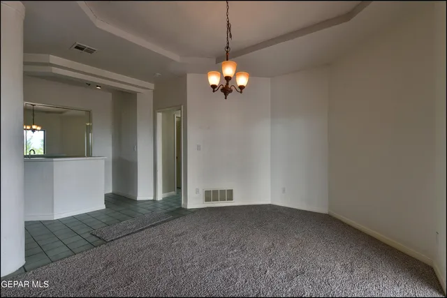 a kitchen with a sink cabinets and window