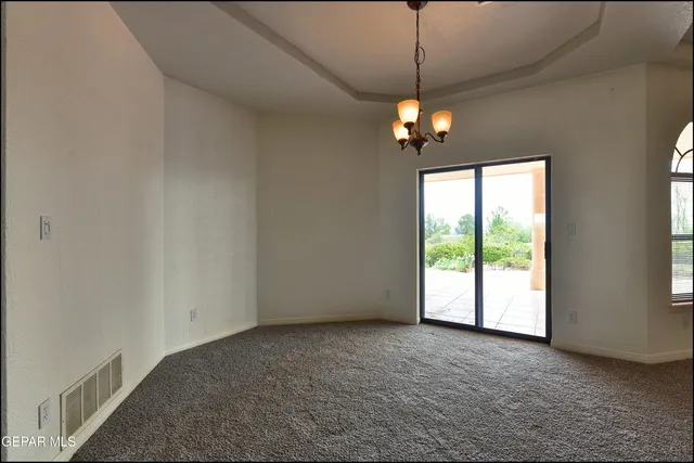 a kitchen with a stove sink and cabinets