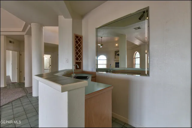 a kitchen with a sink and cabinets