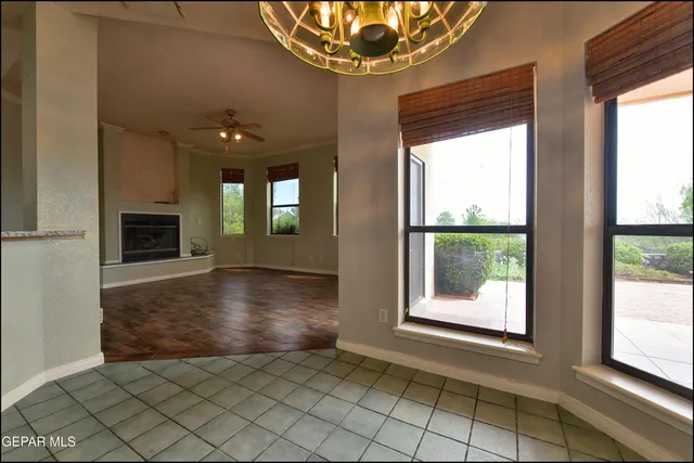a bathroom with a granite countertop sink and a large mirror