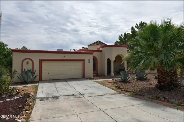 a view of a hallway with wooden floor and a living room