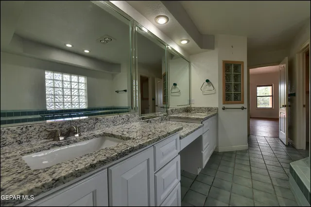 a view of an empty room with a cabinet