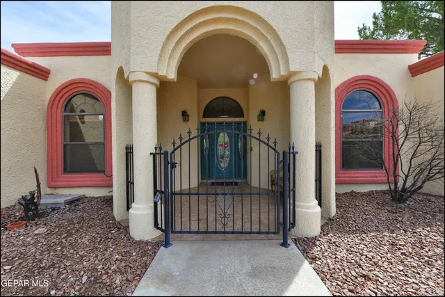 a view of empty room with windows and ceiling fan