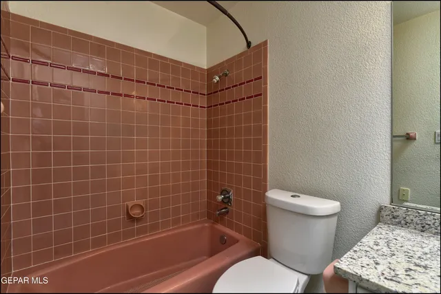 a view of a swimming pool with an outdoor seating