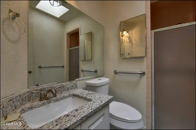 an aerial view of a house with garden space and street view