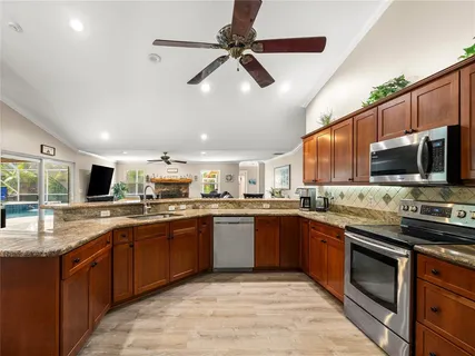 a kitchen with lots of counter top space sink and appliances