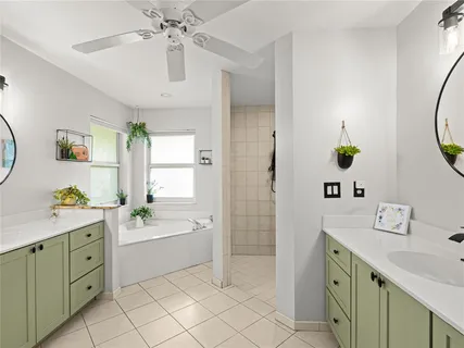 a bathroom with a sink double vanity and a mirror