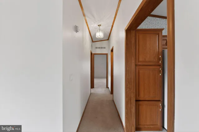 a kitchen with a sink cabinets and window
