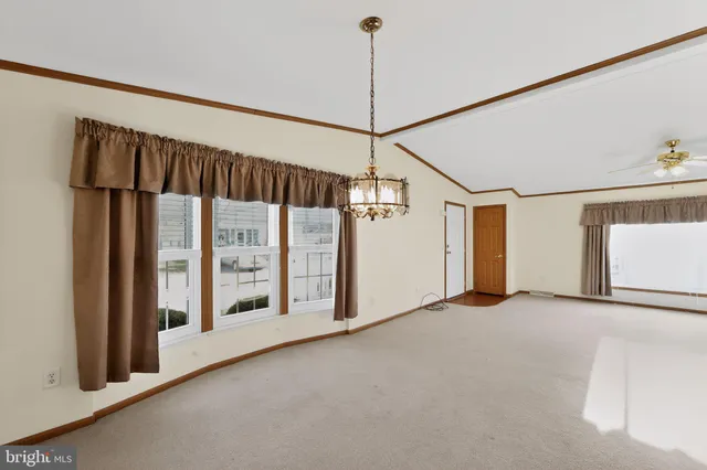 a view of a room with a large window