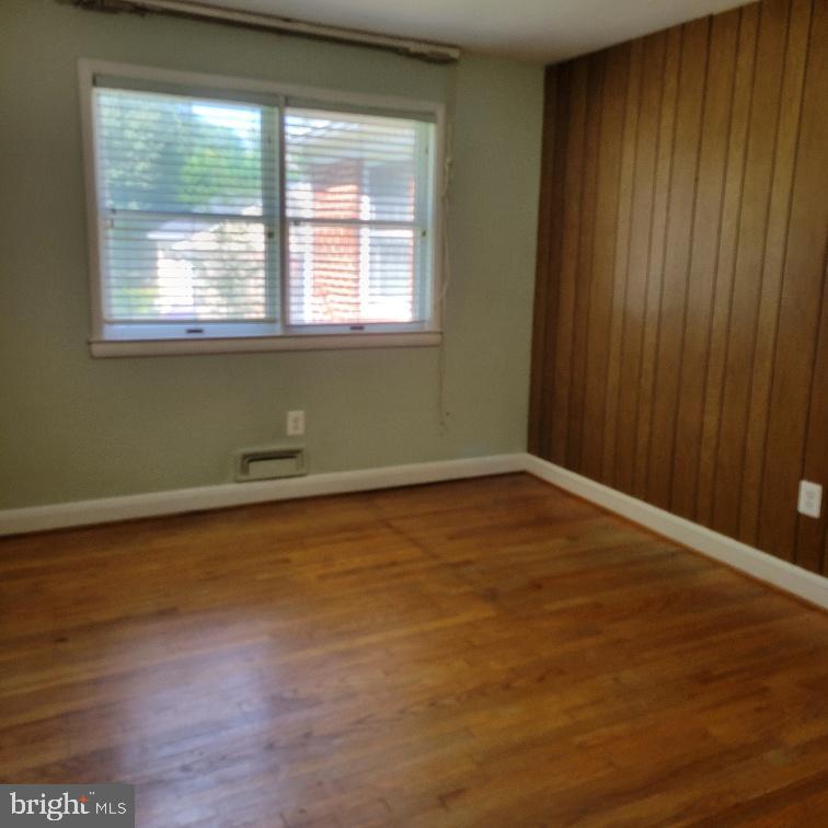 9210 Ravenwood Road Rosedale, MD 21237 - Photo 11 of 18 Bright third bedroom with wooden accents.