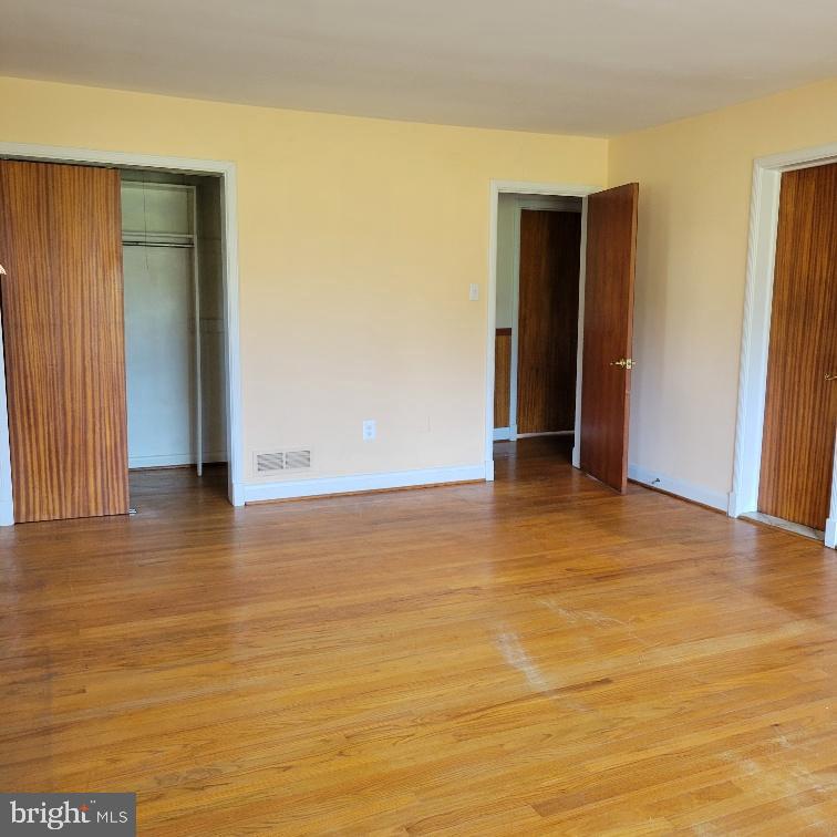 9210 Ravenwood Road Rosedale, MD 21237 - Photo 8 of 18 Primary bedroom with warm wooden floors.
