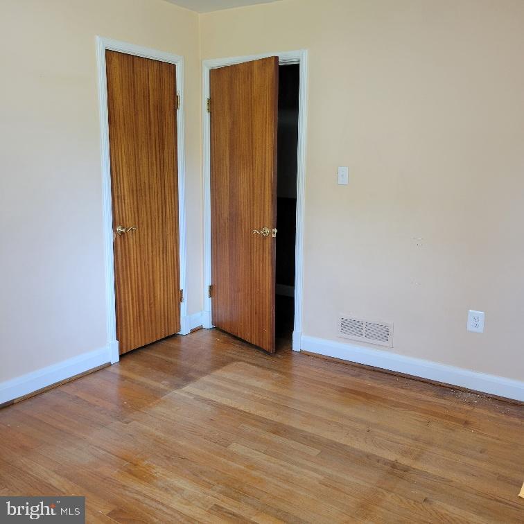 9210 Ravenwood Road Rosedale, MD 21237 - Photo 10 of 18 Bright second bedroom with wooden floors.