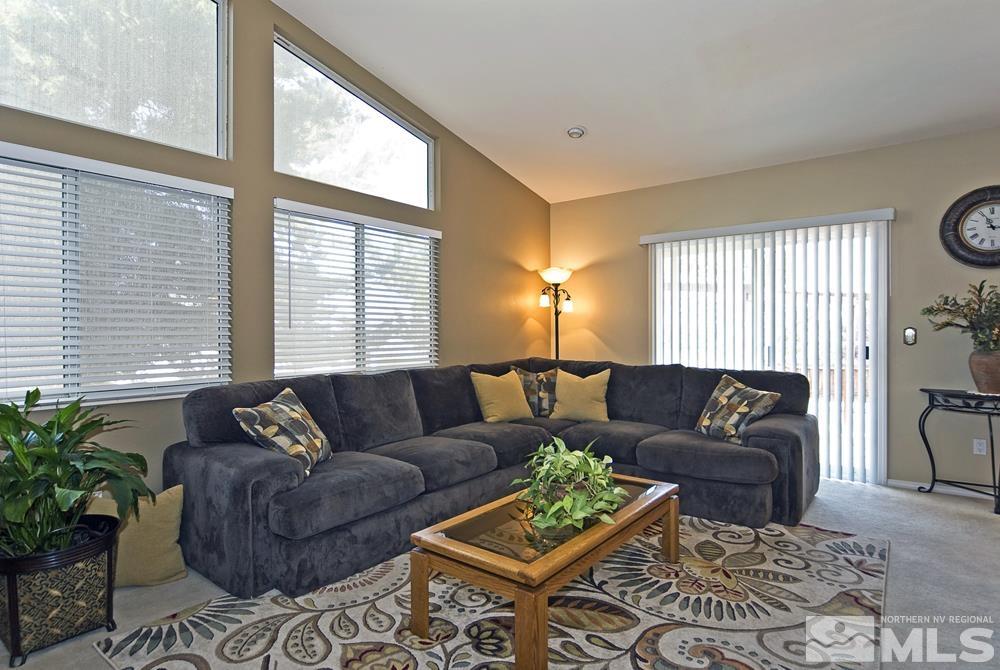 4505 Goodwin Road Sparks, NV 89436 - Photo 12 of 38 a living room with furniture and a large window