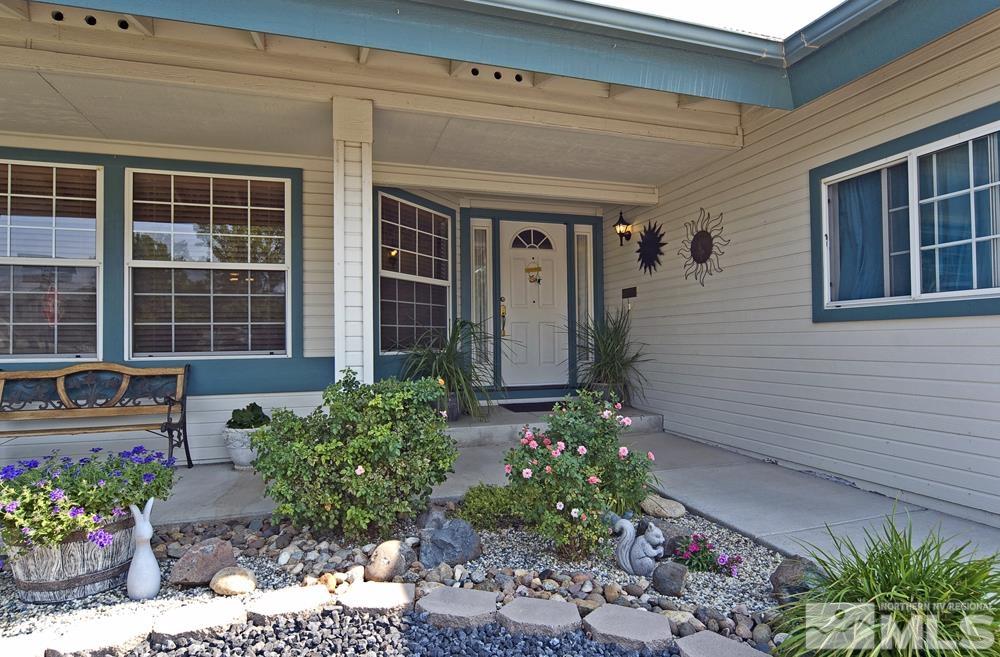 4505 Goodwin Road Sparks, NV 89436 - Photo 3 of 38 a view of a house with potted plants
