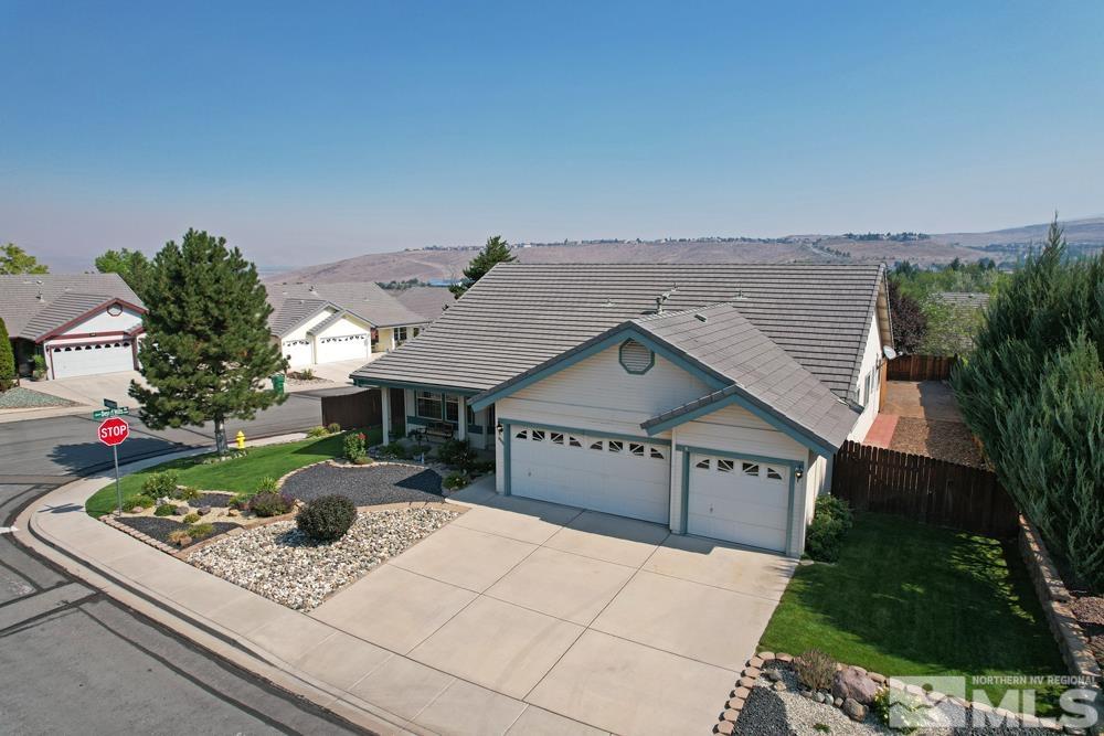 4505 Goodwin Road Sparks, NV 89436 - Photo 7 of 38 a view of a house with a yard and potted plants