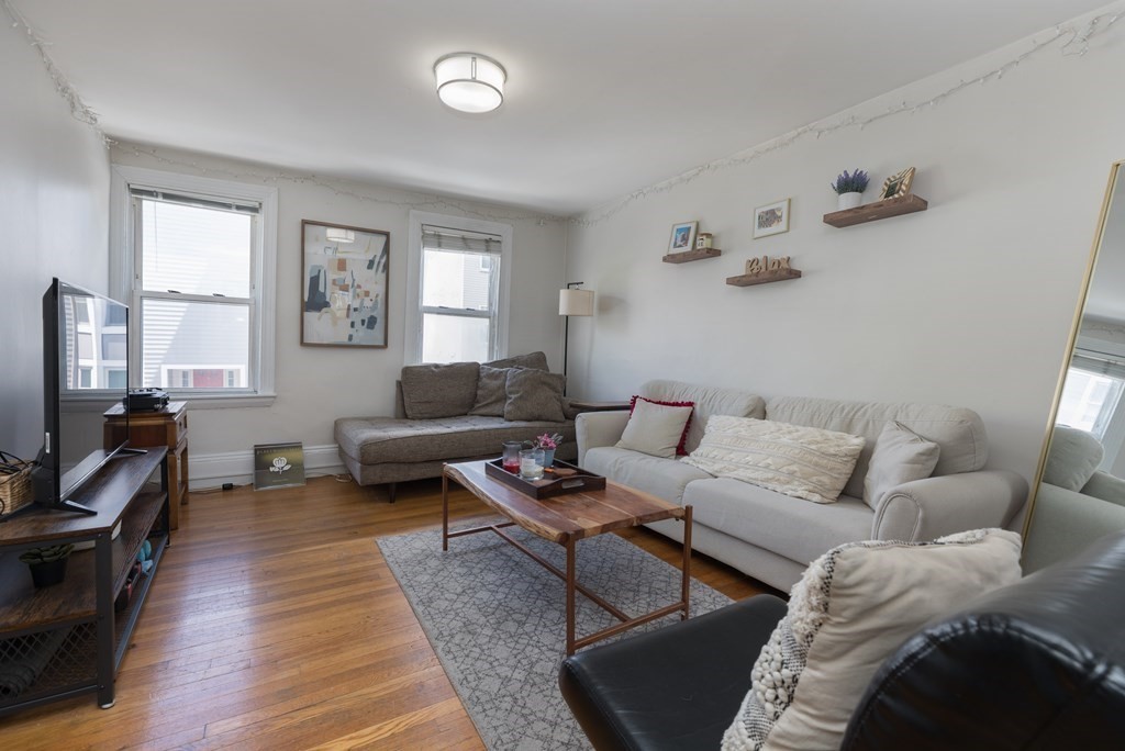 a living room with furniture or couch and a window