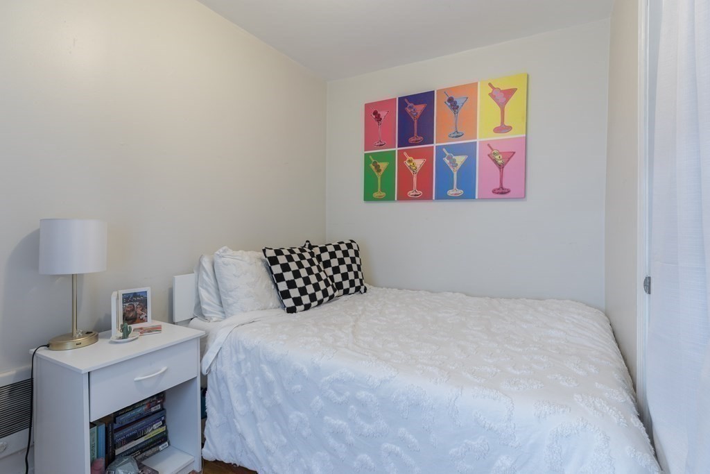 69 I Street, Unit 3 Boston, MA 02127 - Photo 11 of 14 a bedroom with a bed and a desk