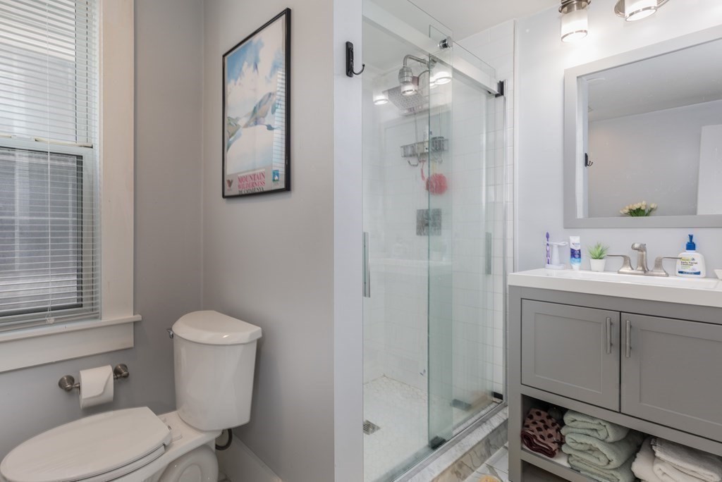 69 I Street, Unit 3 Boston, MA 02127 - Photo 12 of 14 a bathroom with a sink toilet and shower