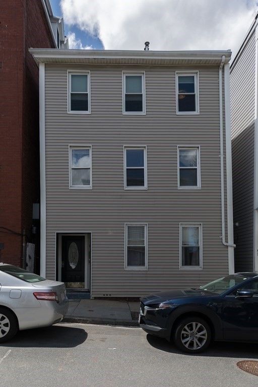 69 I Street, Unit 3 Boston, MA 02127 - Photo 14 of 14 a car parked in front of a house