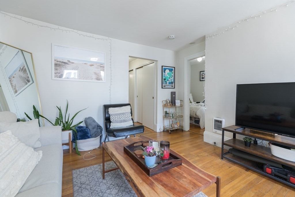 69 I Street, Unit 3 Boston, MA 02127 - Photo 2 of 14 a living room with furniture and a flat screen tv