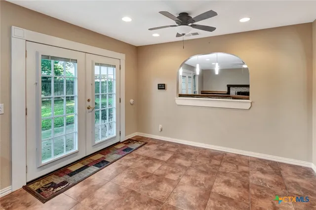 a view of an entryway with a kitchen