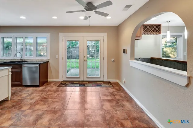an open kitchen with furniture and fireplace