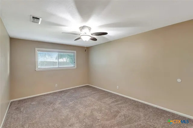 a view of balcony with wooden floor and fence