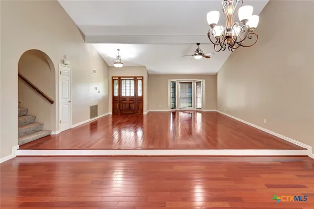 a kitchen with stainless steel appliances granite countertop a stove top oven sink and cabinets