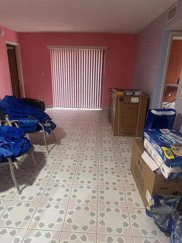 a view of a workspace with furniture