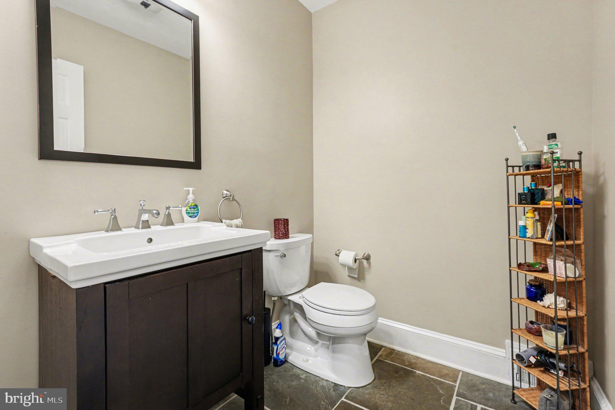 2723 Mill Road Doylestown, PA 18902 - Photo 17 of 39 a bathroom with a sink toilet and vanity