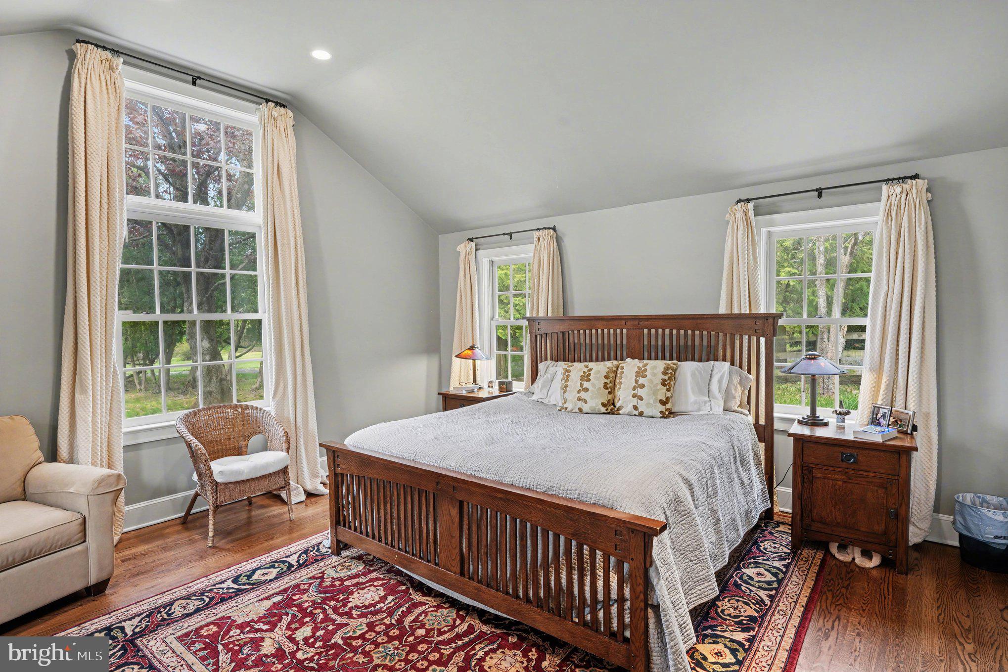 2723 Mill Road Doylestown, PA 18902 - Photo 18 of 39 a bedroom with a bed and wooden floor