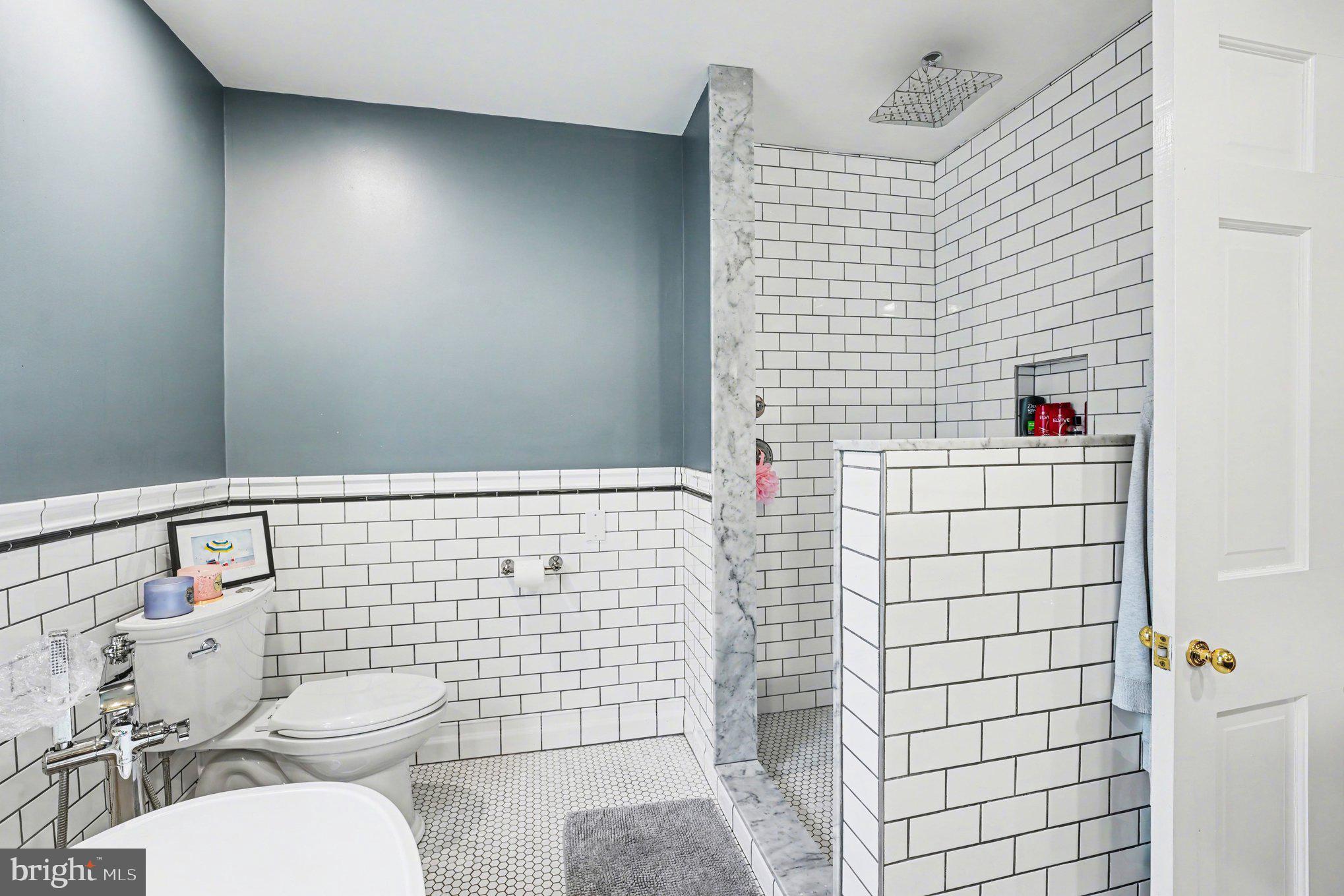 2723 Mill Road Doylestown, PA 18902 - Photo 20 of 39 a bathroom with a toilet and shower