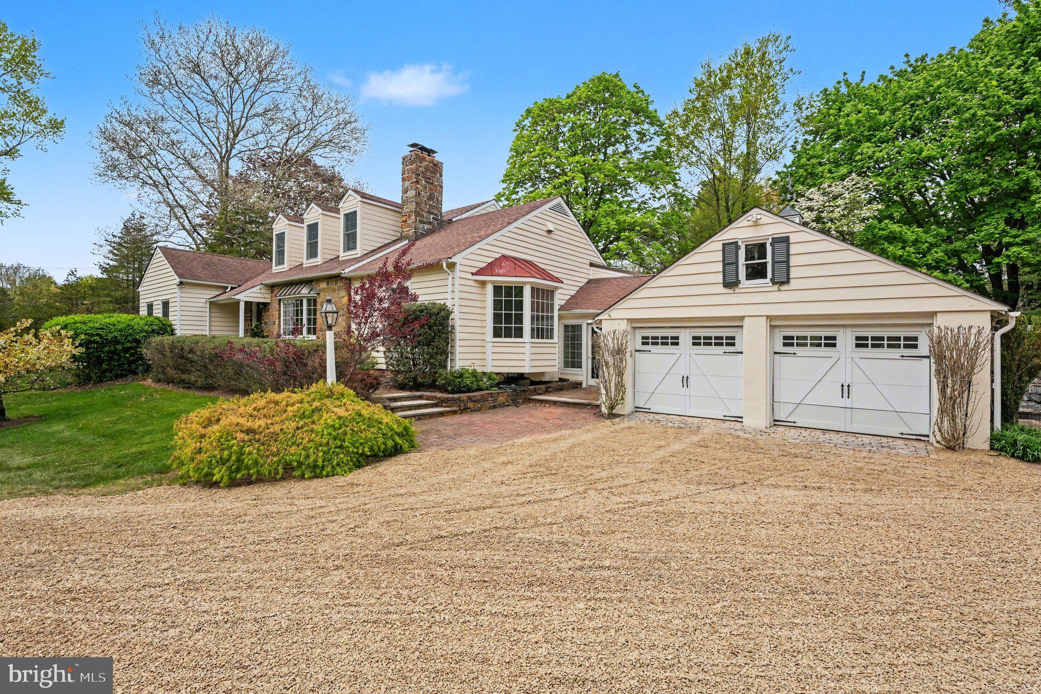 2723 Mill Road Doylestown, PA 18902 - Photo 2 of 39 a front view of a house with a yard and garage