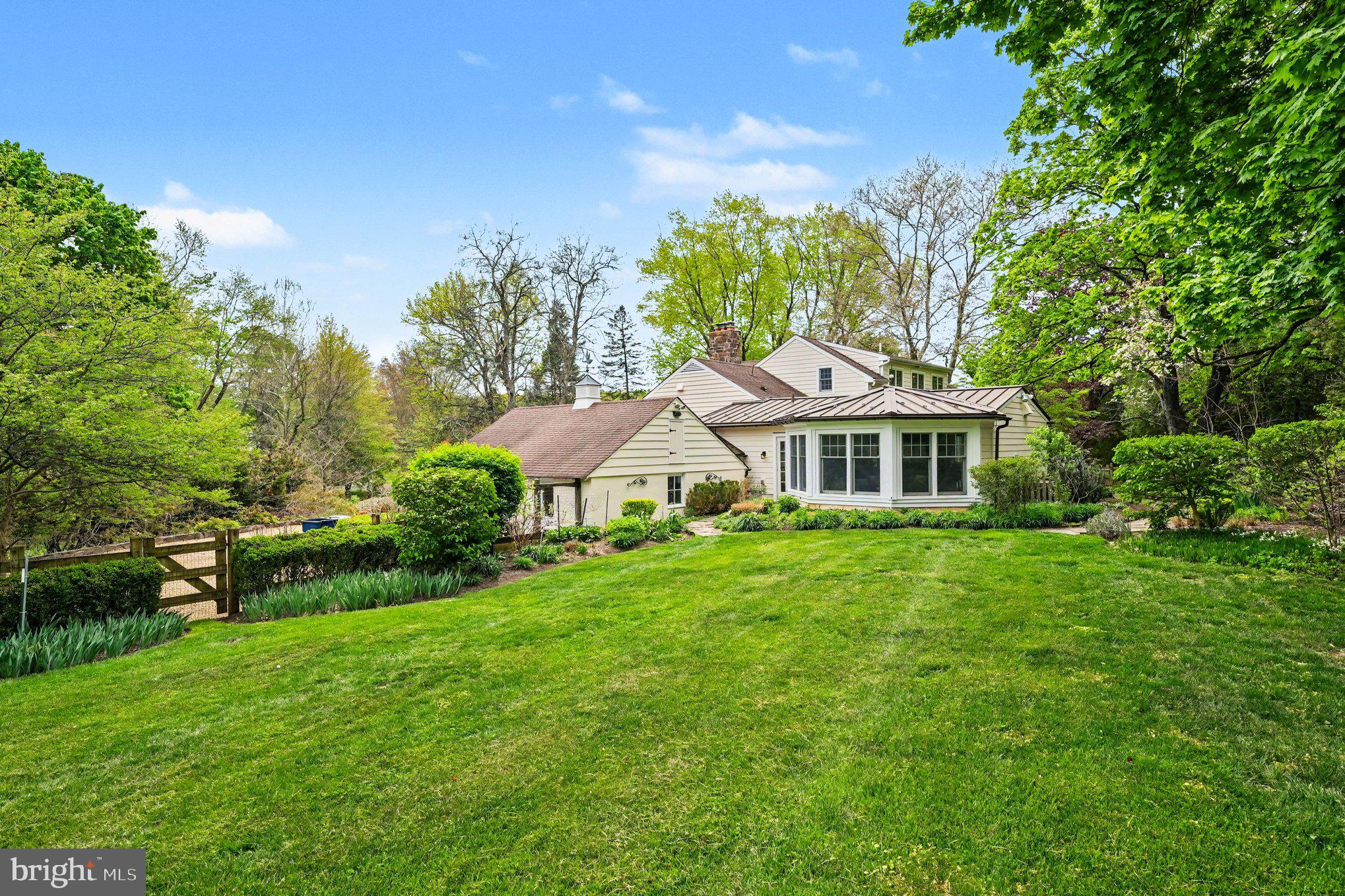 2723 Mill Road Doylestown, PA 18902 - Photo 36 of 39 a front view of a house with a garden