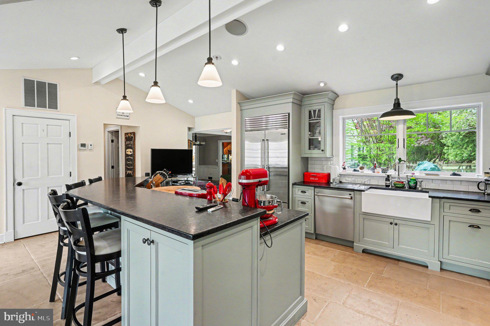 2723 Mill Road Doylestown, PA 18902 - Photo 4 of 39 a kitchen view with living room and flat screen tv